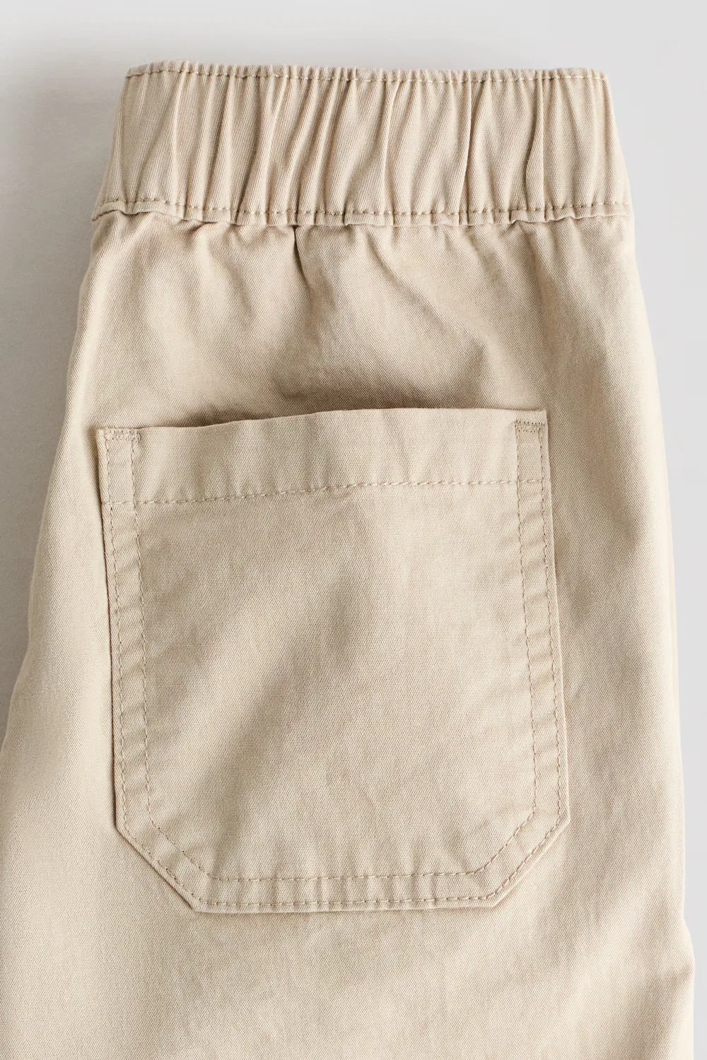 картинка Брюки-Джоггеры карго из хлопчатобумажной саржи H&M, Beige от магазина Одежда+